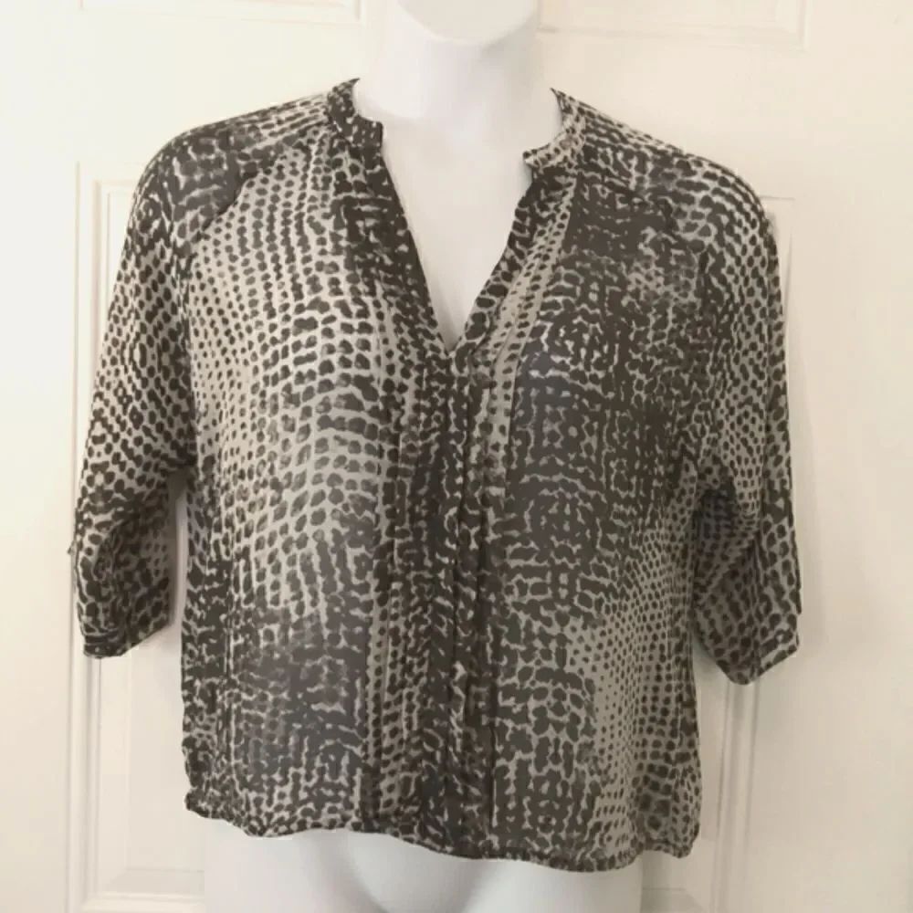 a. n. a charcoal gray and off white animal print 3/4 sleeve semi sheer blouse